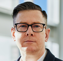 Alexander Hughes en portrait, PDG et dirigeant d’une entreprise de trading de cryptomonnaie